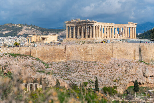 The ancient Acropolis on Acropolis Hill in Athens, Greece, with the Parthenon, Erechtheion, Propylaea, Temple of Athena Nike and Odeon of Herodes Atticus in view.