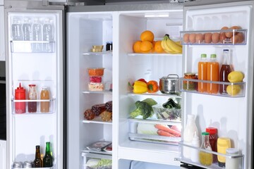 Modern refrigerator with different fresh food products