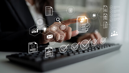 A person uses a digital interface with various icons representing data management and communication, showcasing the blend of technology and innovation in a workspace setting. Gantry