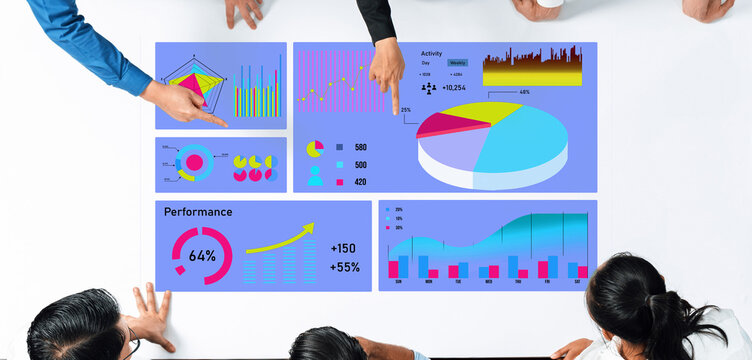 A diverse business team collaborates over a table displaying colorful graphs and charts, focusing on data visualization to enhance performance and activity insights. Axiom - Powered by Adobe