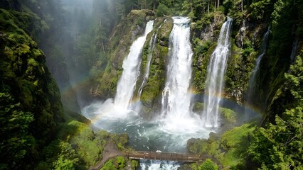 Fototapeta premium Multiple Waterfalls in Lush Green Forest.