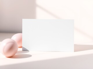 Blank white business card mockup with soft pink spheres and sunlight shadows
