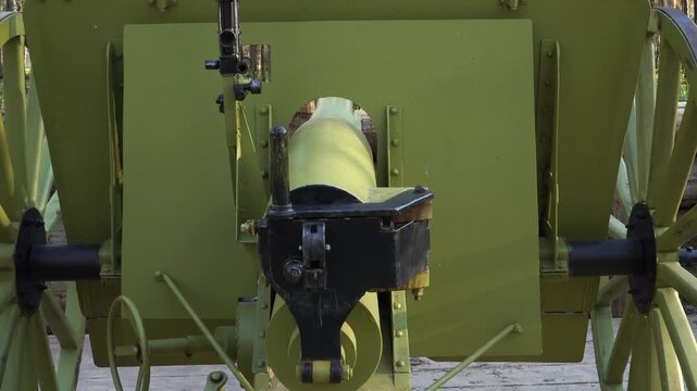 WW1 gun with an optical aiming system in a closeup. A combat weapons exhibit of World War 1 at the site of historical battles in Olaine region, Latvia.