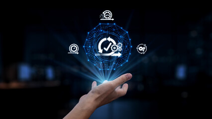 A hand reaches toward a glowing digital interface symbolizing data analysis, automation, and modern technology. The scene highlights innovation and progress in a digital environment. Synapse