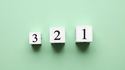 Counting down with numbered blocks on green background