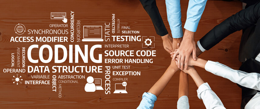 A top-down view of diverse hands collaborating on coding, surrounded by keywords related to programming, illustrating teamwork in software development on a wooden table. Amity - Powered by Adobe