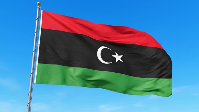 Flag of Libya Waving Against Blue Sky
