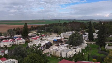 Drone Footage Kfar Aza Village Israel

Drone footage showing an aerial view of Kfar Aza village near the Gaza border, residential homes and surrounding farmland, 23. November 2023, Israel.
