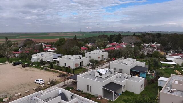 Drone Footage Kfar Aza Village Israel

Drone footage showing an aerial view of Kfar Aza village near the Gaza border, residential homes and surrounding farmland, 23. November 2023, Israel.
