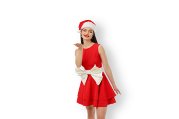 Young woman in red dress and Santa hat blowing kisses, isolated, PNG