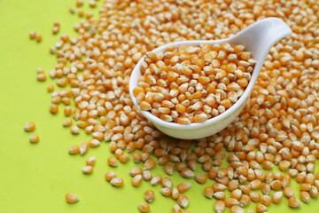 Dry yellow corn seeds ready to be made into popcorn.