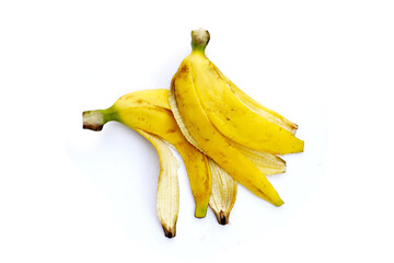 Yellow banana peels isolated on a white background. © Bowonpat