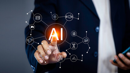 Business hand holding touching AI icon networks. With artificial intelligence (AI)and information exchange, AI machine learning language. Cyber security system using AI technology.