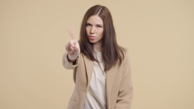 Disappointed Businesswoman Wagging Finger in Disapproval Saying No Gesture. Dissatisfaction, disapproval, firm rejection, conveying authority, boundaries, professional judgment.