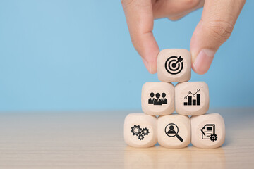 Business target board print screen on wooden cube block among graph mechanical gear and people for Business Achievement objective target concept by 3d rendering.