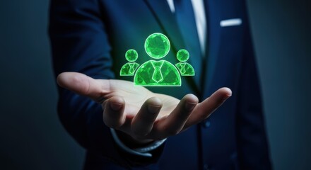 Businessman holding a glowing green team network icon in dark studio