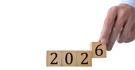 2026 New Year Change Concept With Hand And Wooden Blocks Isolated On transparent Background