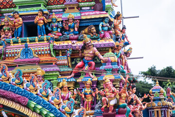 Decorative exterior details of a hindu temple in Matale, Sri Lanka. Colorful sculpted ornaments, traditional carvings and religious symbols showcasing South Asian spiritual architecture.