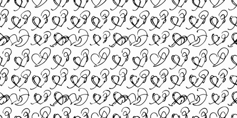 Fototapeta premium Intricate black and white pattern of repeating heart shapes and swirls