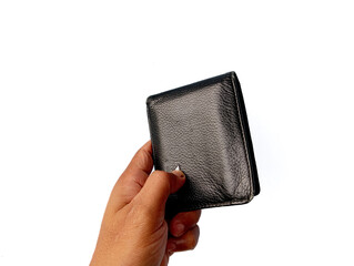 Close-up photo of a human hand holding a closed black leather wallet, isolated on white background, representing personal finance, money storage, and daily essentials.