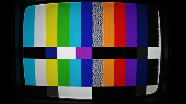 TV Test Pattern: A vintage television screen displays a classic color test pattern. The vibrant bars of color are arranged in a specific order to ensure accurate color reproduction.