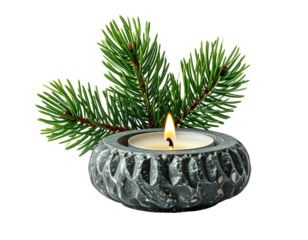 Lit tealight in stone holder with pine sprig