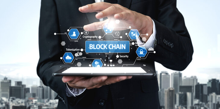 A professional businessman demonstrates the impact of blockchain technology using a tablet in an urban setting, highlighting its benefits in security and innovation. Tessel - Powered by Adobe