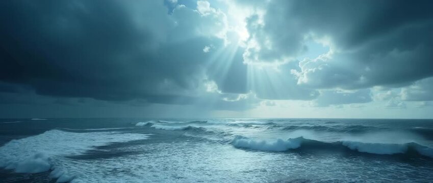 Dramatic ocean waves crash under stormy skies as sunlight pierces through clouds, with a slow cinematic pan capturing the serene yet powerful seascape, perfect for nature documentary footage.
