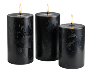 Three black lit candles with flickering flames against a dark backdrop