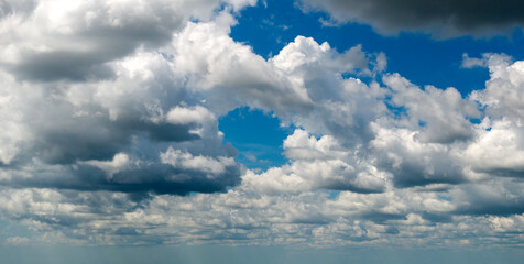 Rain clouds forming on blue Florida sky. Colorful summer skyscape