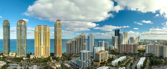 Sunny Isles Beach city with luxurious highrise hotels and condo buildings on Atlantic ocean shore. American tourism infrastructure in southern Florida © bilanol