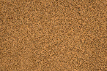 Color of the year 2024 , 13-1023 Peach Fuzz color, plain textured background. Red pink in plaster stucco cement concrete wall pattern texture backdrop. front view