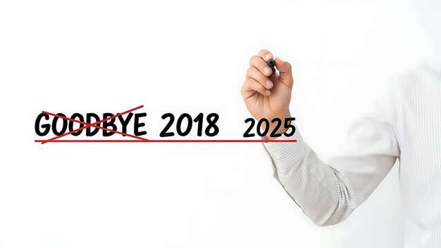 Businessman crosses out goodbye 2018 and writes 2025 symbolizing future planning and goal setting