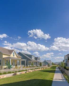 Community lawn between homes and sidewalks