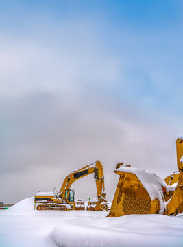 Construction vehicles on a heap of snow in Utah