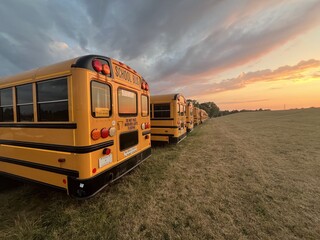 Yellow buses parked at sunset - Bus jaunes gar&eacute;s au coucher de soleil