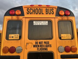 Rear view of a yellow school bus in Canada - Vue arri&egrave;re d'un bus scolaire au Canada