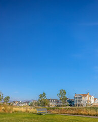Park and homes against blue sky in Daybreak Utah