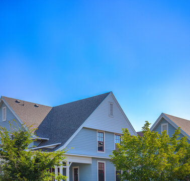 White and blue house with trees in Utah