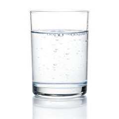Clear glass filled with sparkling water showcases bubbles rising to surface against transparent background, creating refreshing visual