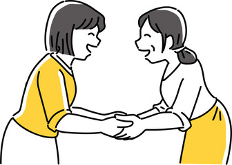 Fototapeta premium 笑顔で手を握る女性2人