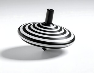 Black and white striped spinning top, isolated on white background