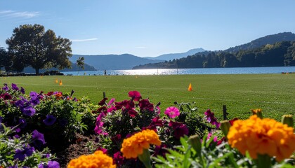 Sunny Lakeside Landscape with Colorful Flowers in Foreground