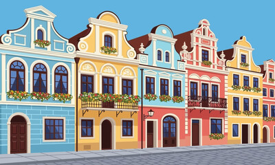 Obraz premium Colorful, Distinctive European Townhouses in a Row with Detailed Architecture and Flower Boxes