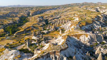Goreme, Nevsehir, Turkey. Aerial view of the unique rock formations in Gorkundere, also known as Rocket Valley, a surreal landscape of tall fairy chimneys in Cappadocia.. Aerial View