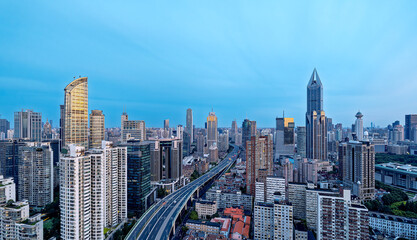 Obraz premium Aerial view of the modern city commercial buildings and elevated highway in Shanghai.