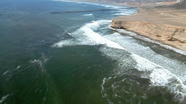 Aerial view of the coast of Eten, Lambayeque in northern Peru, with the lighthouse overlooking the Pacific Ocean and the arid coastal landscape in summer