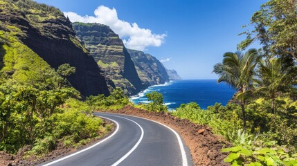 Obraz premium A winding road curves along a scenic coastline