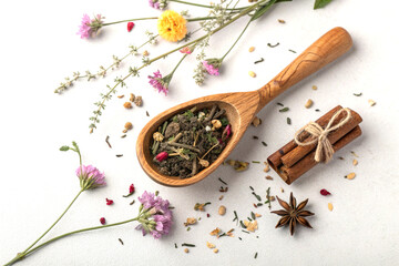 Tea leaves with wooden scoop still life