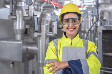 Engineer monitors real-time HVAC system performance and thermal data via mobile digital interface